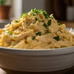 Creamy chicken soup salad recipe served cold with shredded chicken and parsley